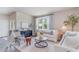 Cozy living room with neutral decor, large window, patterned rug, and comfortable seating at 430 Acosta Circle, Conway, SC 29527