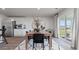 Modern dining room with a wooden table, seating for six, and sliding glass doors at 438 Acosta Circle, Conway, SC 29527