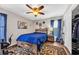 Comfortable bedroom featuring a rustic wood bed frame, ceiling fan, and wood-look flooring at 4405 Boxwood St., Myrtle Beach, SC 29577