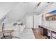 Bright bedroom featuring a television, slanted ceilings, and neutral walls at 4405 Boxwood St., Myrtle Beach, SC 29577