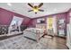 Inviting bedroom with a statement wall, ceiling fan, and a comfortable window seat at 4405 Boxwood St., Myrtle Beach, SC 29577