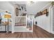 Bright foyer features wood floors, staircase, and decorative wainscoting at 4405 Boxwood St., Myrtle Beach, SC 29577