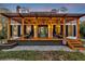 Inviting covered front porch with seating, decorative lighting, and an American flag accent at 4405 Boxwood St., Myrtle Beach, SC 29577