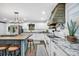 Well-lit kitchen featuring granite countertops, white cabinets, and stainless steel appliances at 4405 Boxwood St., Myrtle Beach, SC 29577