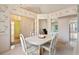 Charming dining area featuring floral wallpaper, carpet, and seamless access to other living spaces at 4746 Harvest Dr., Myrtle Beach, SC 29579