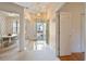 Bright foyer showcasing tile and carpet flooring, connecting to the dining area, and the main entrance at 4746 Harvest Dr., Myrtle Beach, SC 29579