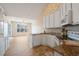 Charming kitchen with white cabinets, granite countertops and stainless steel appliances at 4746 Harvest Dr., Myrtle Beach, SC 29579