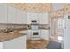 Bright kitchen featuring white appliances, ample counter space, and a functional layout at 4746 Harvest Dr., Myrtle Beach, SC 29579