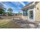 Back patio is easily accessible from the sunroom and provides views of the surrounding property at 4746 Harvest Dr., Myrtle Beach, SC 29579