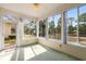 Bright sunroom features large windows with scenic views at 4746 Harvest Dr., Myrtle Beach, SC 29579