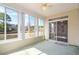 Bright sunroom features large windows with views of the outdoors at 4746 Harvest Dr., Myrtle Beach, SC 29579