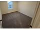 Carpeted bedroom with neutral walls and a window letting in natural light at 531 Tillage Ct., Conway, SC 29526