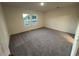 Spacious bedroom featuring plush carpeting, neutral walls, and large windows providing natural light at 531 Tillage Ct., Conway, SC 29526