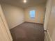 Cozy carpeted bedroom featuring neutral walls and a window letting in natural light at 531 Tillage Ct., Conway, SC 29526