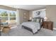 Bright bedroom with a large window, comfortable chair, and modern surfer decor at 543 Slaty Dr., Myrtle Beach, SC 29588