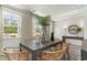 Dining room featuring wood table, stylish chairs, and a window overlooking the backyard at 543 Slaty Dr., Myrtle Beach, SC 29588