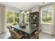 Bright dining room boasts modern lighting, large windows, and ample seating for Gathering gatherings at 543 Slaty Dr., Myrtle Beach, SC 29588