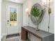 Elegant foyer features wood-look flooring, a rustic wood console table, and decorative lighting at 543 Slaty Dr., Myrtle Beach, SC 29588