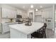 Bright, open kitchen featuring white cabinets, stainless steel appliances, and an oversized kitchen island at 543 Slaty Dr., Myrtle Beach, SC 29588