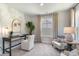 Charming home office with a modern desk, stylish chair, and a soothing leafy wallpaper design at 543 Slaty Dr., Myrtle Beach, SC 29588