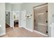 Bathroom view showing a walk-in shower and doorway to the main bedroom at 5508 Leatherleaf Dr., North Myrtle Beach, SC 29582