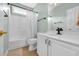 A full bathroom showcasing a shower/tub combo, tile flooring, and a white vanity at 5508 Leatherleaf Dr., North Myrtle Beach, SC 29582