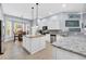 Well-equipped kitchen with stainless appliances, granite countertops, island and adjacent breakfast nook at 5508 Leatherleaf Dr., North Myrtle Beach, SC 29582