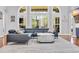 Close up of the living room featuring a stylish sofa, decorative pillows and an area rug over hardwood floors at 5508 Leatherleaf Dr., North Myrtle Beach, SC 29582