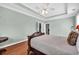 Neutral bedroom with a carved, decorative wood bedframe and hardwood flooring at 5508 Leatherleaf Dr., North Myrtle Beach, SC 29582