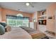 Serene bedroom featuring large windows and a relaxing sitting area at 5750 Oyster Catcher Dr. # 522, North Myrtle Beach, SC 29582