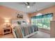 Comfortable bedroom featuring a large window with a view and soothing color scheme at 5750 Oyster Catcher Dr. # 522, North Myrtle Beach, SC 29582
