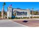 The Barefoot Resort & Golf sign greets visitors with its manicured landscaping and clear blue skies at 5750 Oyster Catcher Dr. # 522, North Myrtle Beach, SC 29582