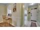 Hallway with tiled floors and neutral paint, with access to kitchen and front door at 5750 Oyster Catcher Dr. # 522, North Myrtle Beach, SC 29582