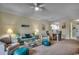 Open-concept living room with ample seating, stylish decor, and seamless flow to dining area at 5750 Oyster Catcher Dr. # 522, North Myrtle Beach, SC 29582