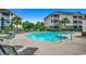 Large community pool offers ample seating and lounge space, near neighboring residential buildings at 5750 Oyster Catcher Dr. # 522, North Myrtle Beach, SC 29582