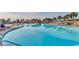Large in-ground pool with lounge chairs surrounding for a relaxing day near the community building at 5750 Oyster Catcher Dr. # 522, North Myrtle Beach, SC 29582