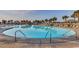 Large outdoor pool perfect for swimming laps or relaxing with friends with resort buildings in the background at 5750 Oyster Catcher Dr. # 522, North Myrtle Beach, SC 29582