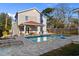 Fenced backyard with an in ground pool, lounge chairs, and pool house at 607 18Th Ave. S, North Myrtle Beach, SC 29582