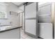 Bathroom featuring a granite vanity, walk-in shower, and laundry machine at 607 18Th Ave. S, North Myrtle Beach, SC 29582