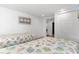 Bright bedroom featuring two twin beds, crisp white walls, and an open doorway to adjacent room at 607 18Th Ave. S, North Myrtle Beach, SC 29582