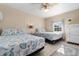 Bedroom featuring two queen beds with matching bedding, ceiling fan, and tile floors at 607 18Th Ave. S, North Myrtle Beach, SC 29582