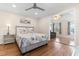 Nicely decorated bedroom with a queen bed, ceiling fan, and an open doorway to adjacent room at 607 18Th Ave. S, North Myrtle Beach, SC 29582