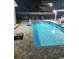 Swimming pool in backyard at nighttime at 607 18Th Ave. S, North Myrtle Beach, SC 29582