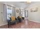 Comfortable sunroom with gray chairs, tile flooring, and lots of natural light at 607 18Th Ave. S, North Myrtle Beach, SC 29582