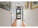 Hallway featuring wood floors, and door to a front porch at 609 23Rd Ave. N, North Myrtle Beach, SC 29582