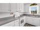 White kitchen featuring gray countertops and a window over the sink at 609 23Rd Ave. N, North Myrtle Beach, SC 29582