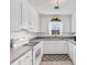 White kitchen featuring tile floors and a window over the sink at 609 23Rd Ave. N, North Myrtle Beach, SC 29582