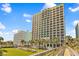 Beautiful exterior view of a high-rise resort with multiple balconies overlooking the ocean, pool, and beach at 6804 N Ocean Blvd. # 533, Myrtle Beach, SC 29572