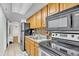 Efficient kitchen featuring oak cabinets and stainless steel appliances at 6804 N Ocean Blvd. # 533, Myrtle Beach, SC 29572