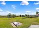 Manicured lawn next to beach with cornhole, seating, and distant ocean views. Perfect relaxation spot at 6804 N Ocean Blvd. # 533, Myrtle Beach, SC 29572